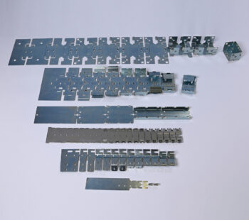 Strips of parts made by follow-through tools